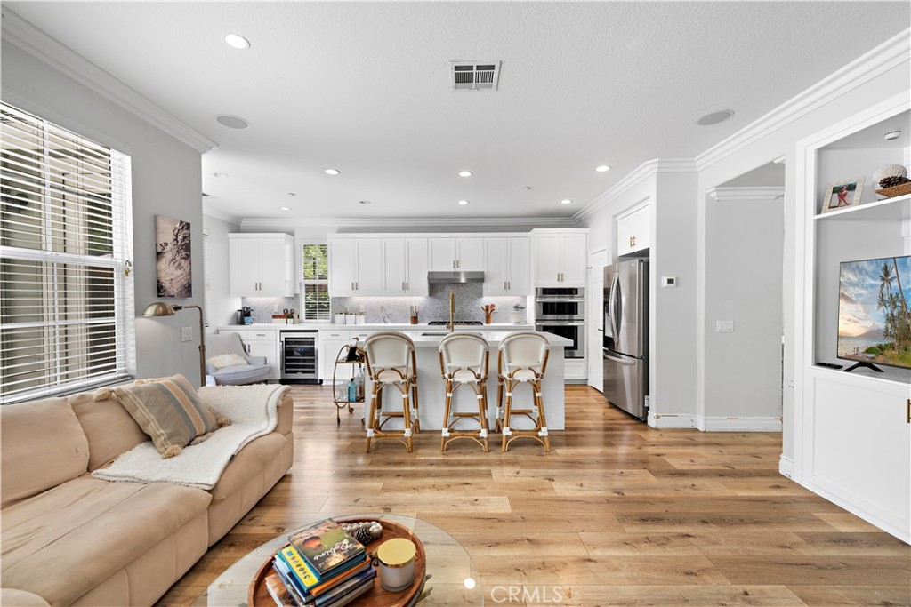8 Bluewing Lane Ladera Ranch, CA 92694 - Photo 15 of 55 a living room with lots of furniture and a view of kitchen