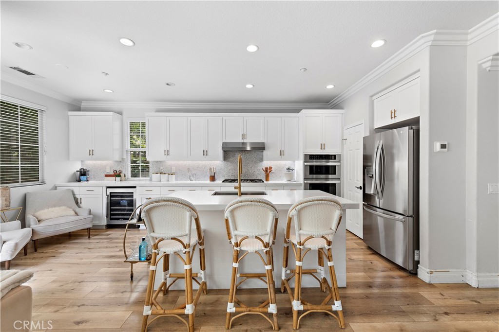 8 Bluewing Lane Ladera Ranch, CA 92694 - Photo 16 of 55 a living room with stainless steel appliances furniture a refrigerator and a kitchen