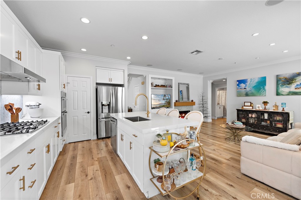 8 Bluewing Lane Ladera Ranch, CA 92694 - Photo 19 of 55 a large white kitchen with stainless steel appliances