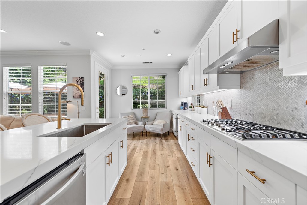 8 Bluewing Lane Ladera Ranch, CA 92694 - Photo 20 of 55 a large white kitchen with a large window