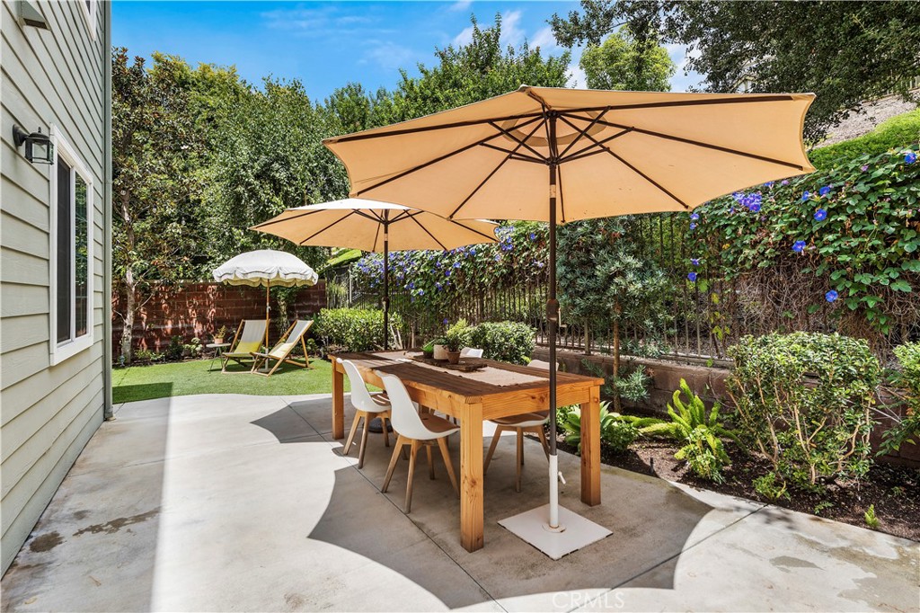 8 Bluewing Lane Ladera Ranch, CA 92694 - Photo 25 of 55 an outdoor space with furniture and umbrella