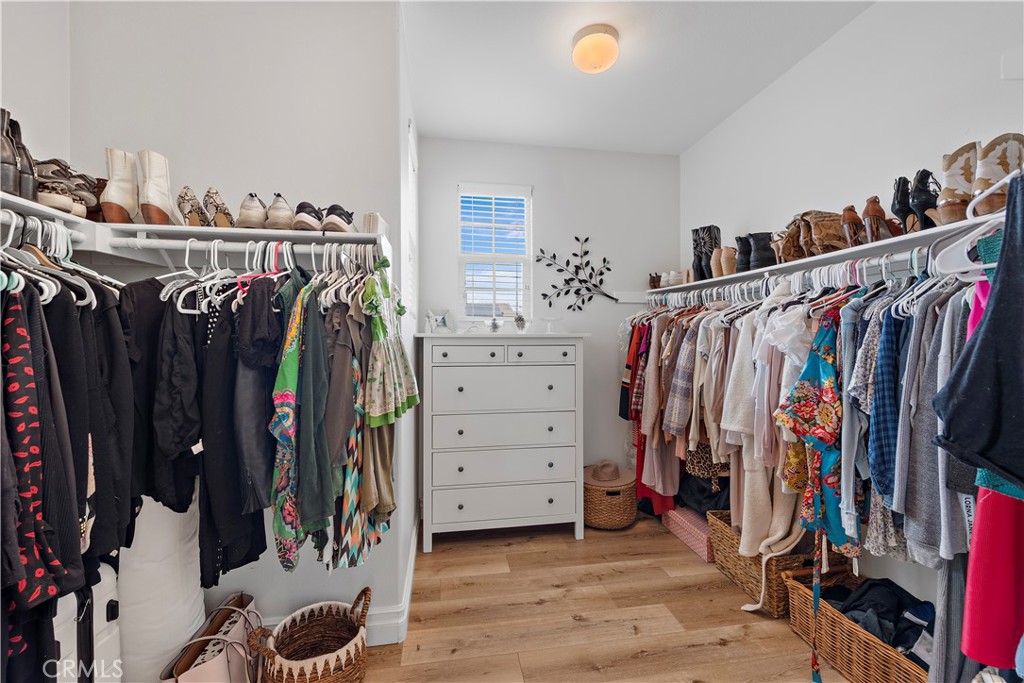 8 Bluewing Lane Ladera Ranch, CA 92694 - Photo 33 of 55 a view of walk in closet with clothes and shoes