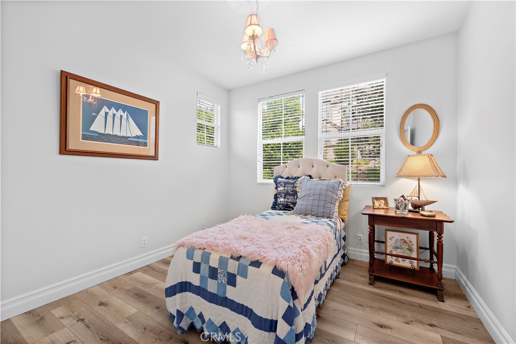 8 Bluewing Lane Ladera Ranch, CA 92694 - Photo 36 of 55 a bedroom with a bed a dresser and windows