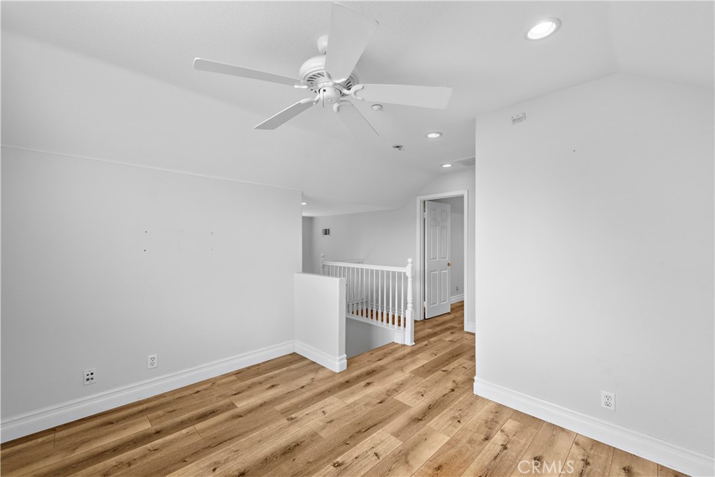 8 Bluewing Lane Ladera Ranch, CA 92694 - Photo 41 of 55 a view of empty room with wooden floor and fan