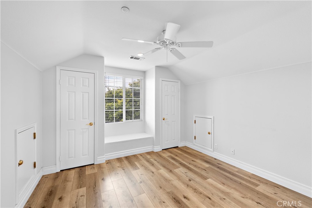 8 Bluewing Lane Ladera Ranch, CA 92694 - Photo 42 of 55 a view of empty room with wooden floor and fan
