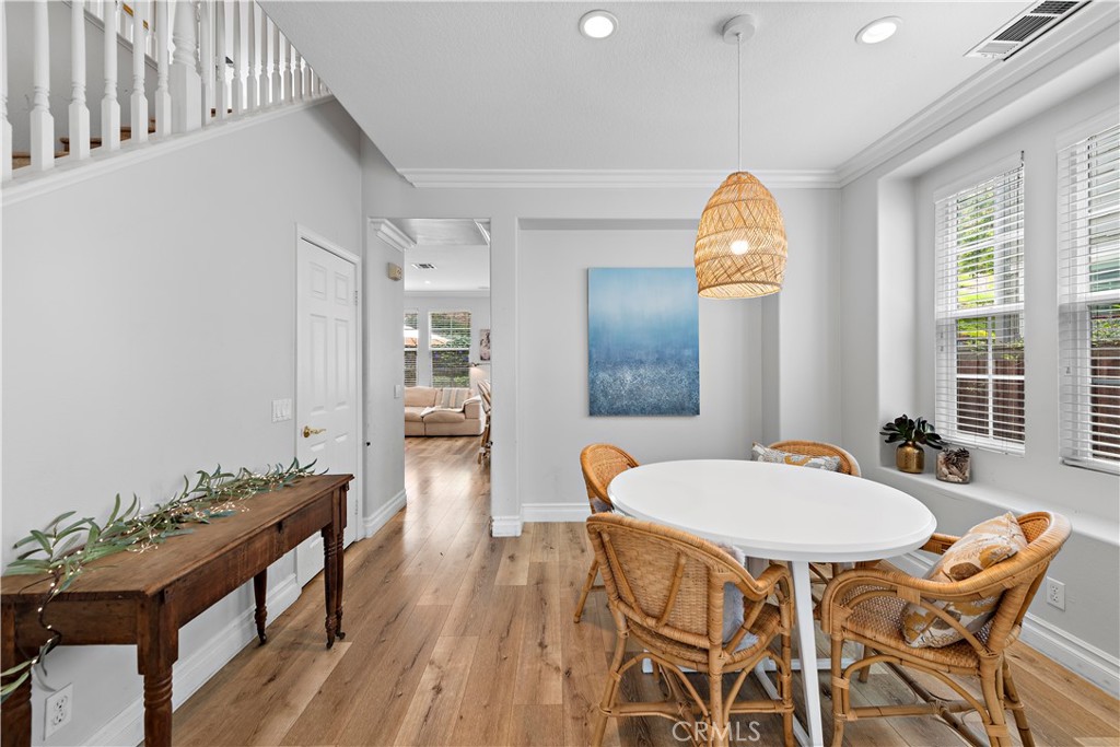 8 Bluewing Lane Ladera Ranch, CA 92694 - Photo 10 of 55 a view of a dining room with furniture and wooden floor