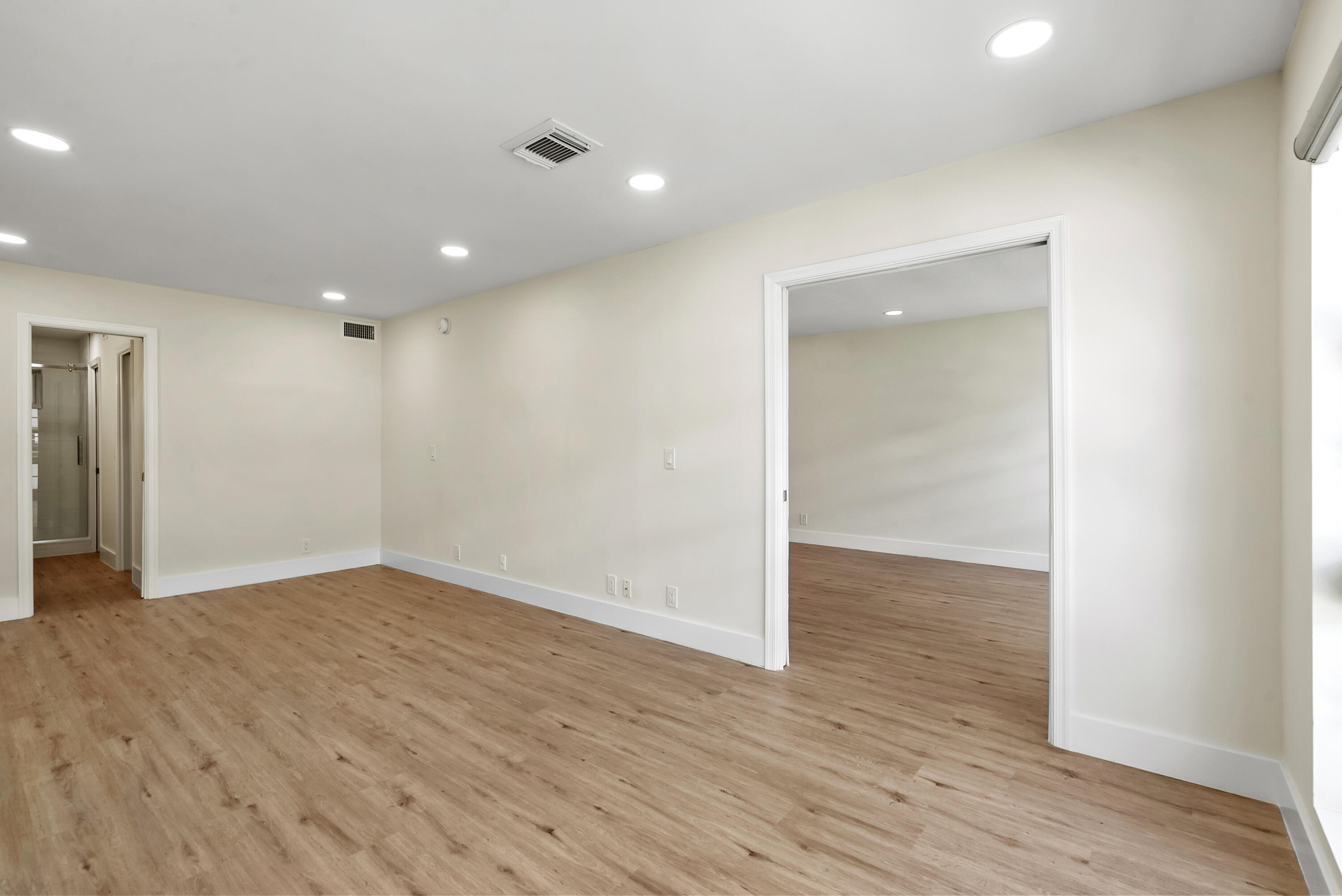 3851 North Ocean Boulevard, Unit 211 Gulf Stream, FL 33483 - Photo 10 of 19 a view of an empty room with wooden floor
