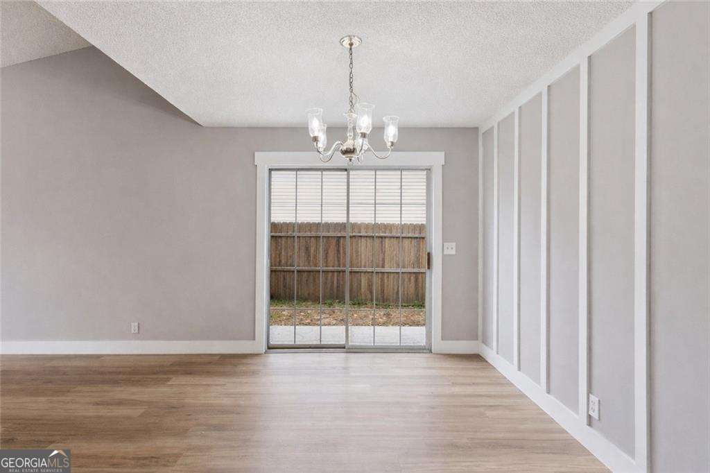 336 Terrapin Trail Brunswick, GA 31525 - Photo 12 of 24 a view of a room with wooden floor and balcony
