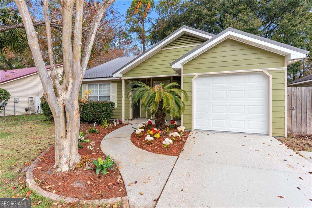 336 Terrapin Trail Brunswick, GA 31525 - Photo 3 of 24 a front view of a house with garden