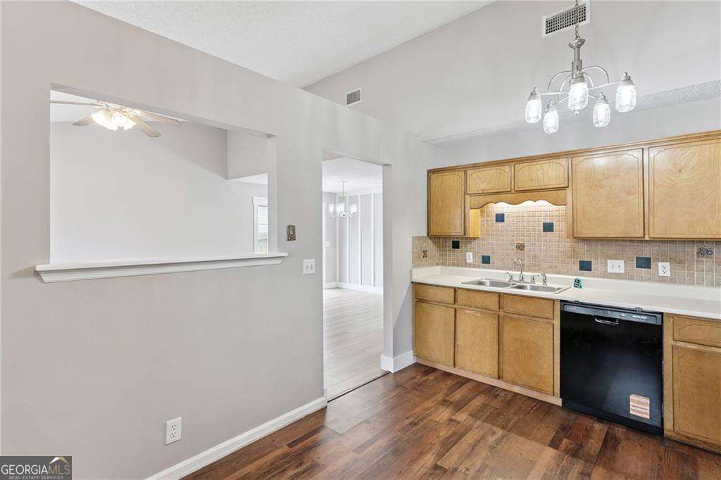336 Terrapin Trail Brunswick, GA 31525 - Photo 9 of 24 a kitchen with a refrigerator sink and cabinets