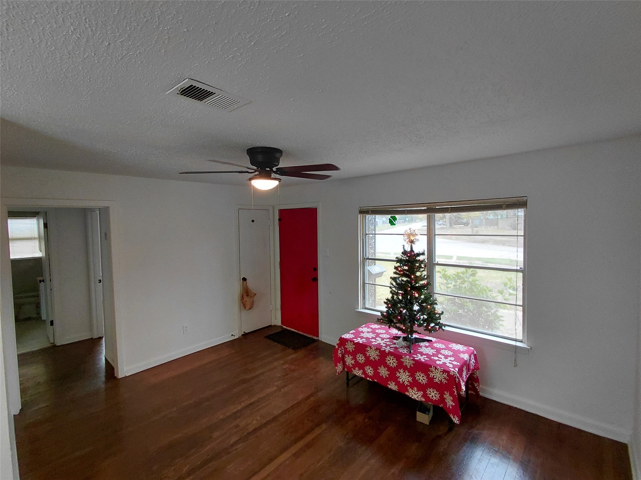 201 Delta Street Pasadena, TX 77506 - Photo 12 of 19 a living room with furniture window and wooden floor