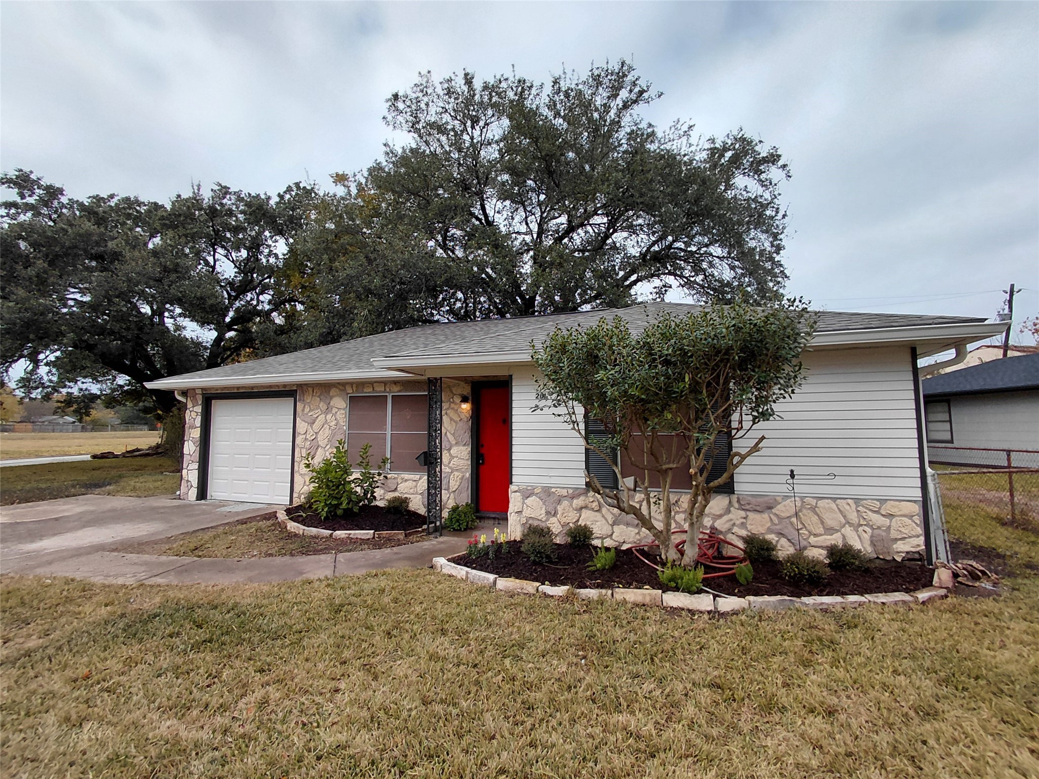 201 Delta Street Pasadena, TX 77506 - Photo 2 of 19 a front view of a house with garden