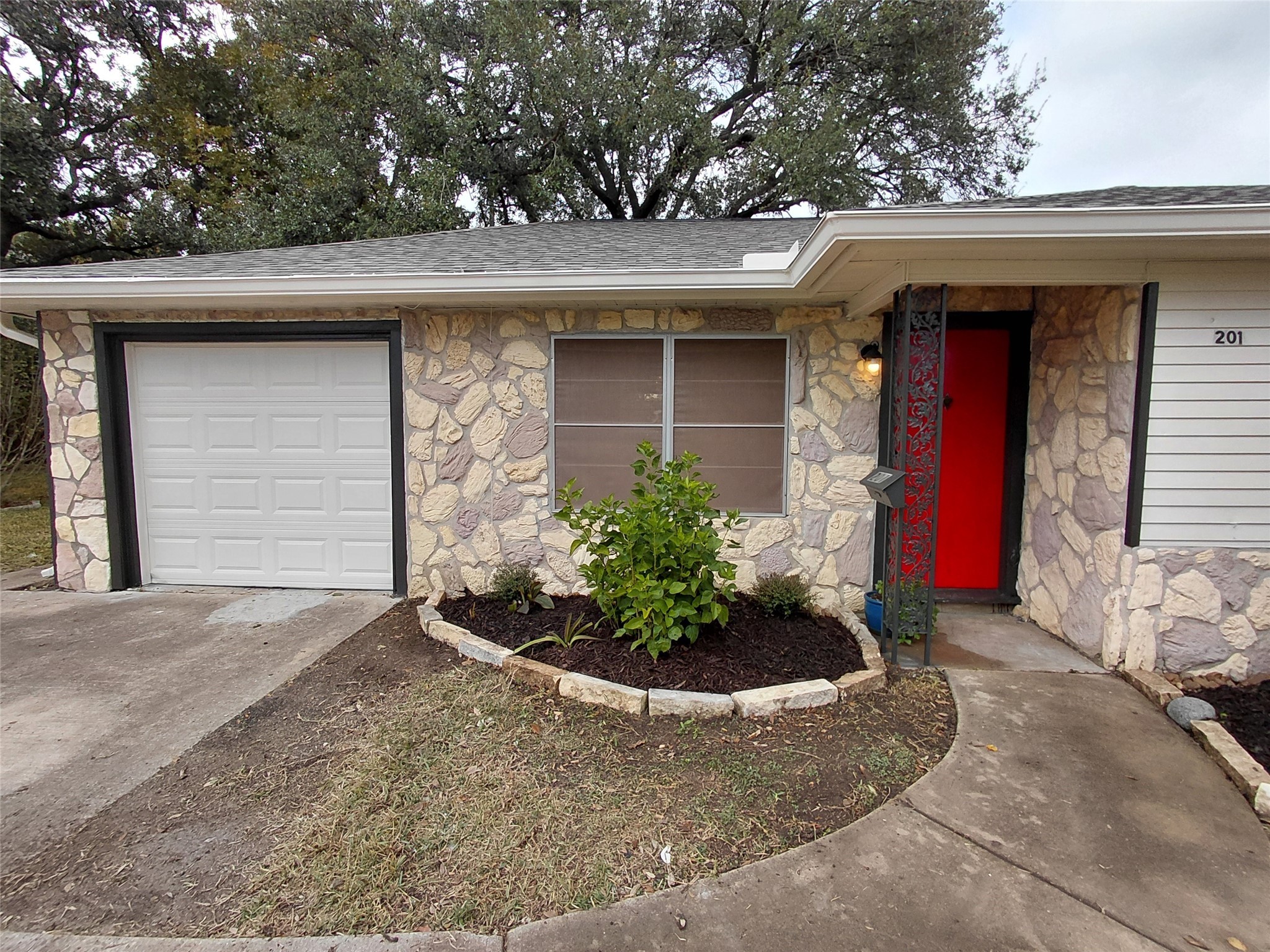 201 Delta Street Pasadena, TX 77506 - Photo 4 of 19 a front view of a house with garden