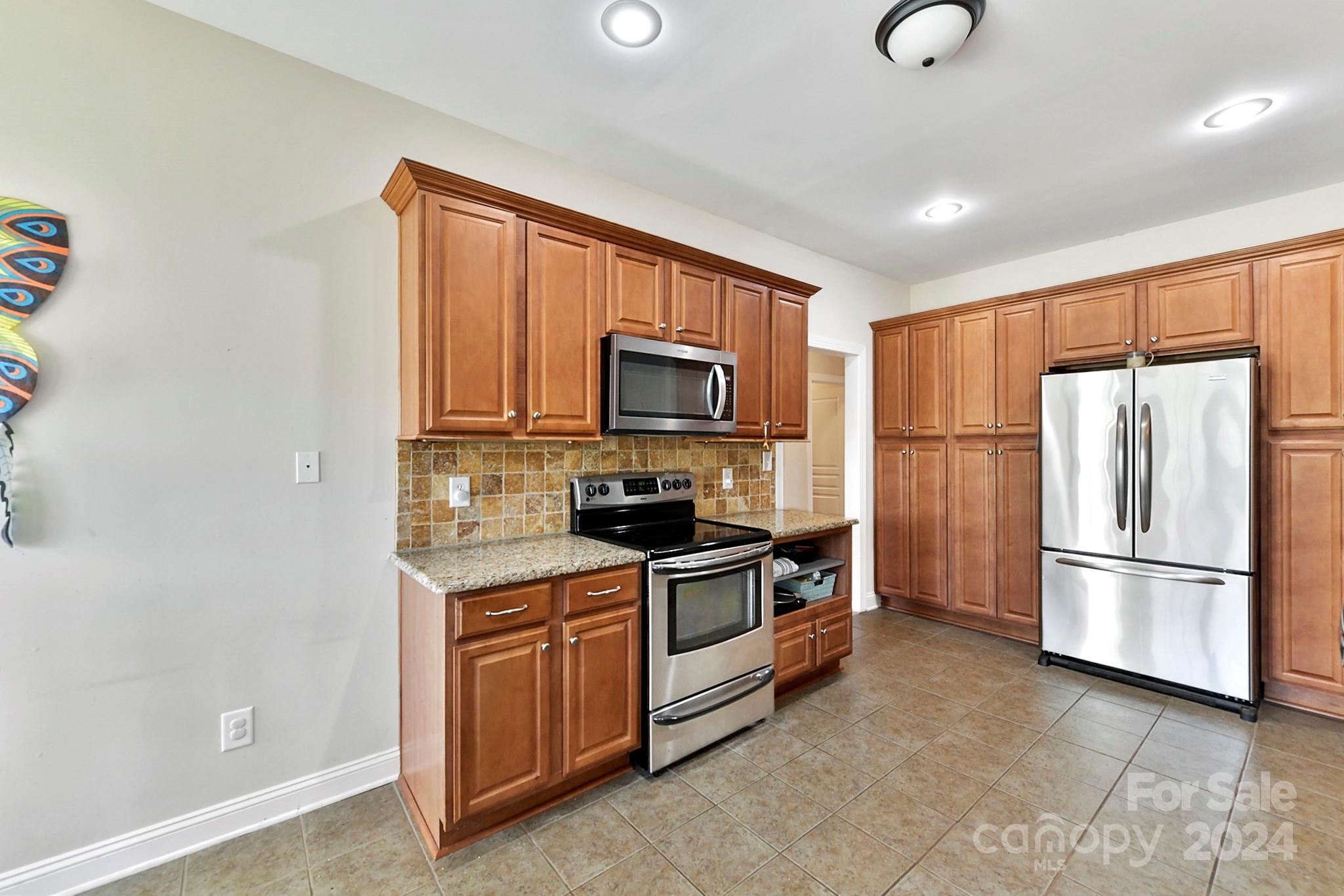 1072 Arabian Farm Road Clover, SC 29710 - Photo 26 of 47 a kitchen with a refrigerator stove and microwave