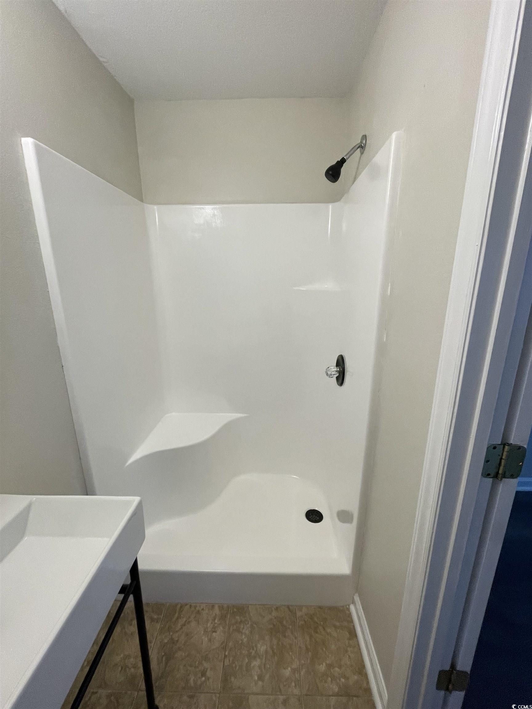 4641 Socastee Boulevard, Unit E1 Myrtle Beach, SC 29588 - Photo 14 of 20 Bathroom with a shower stall