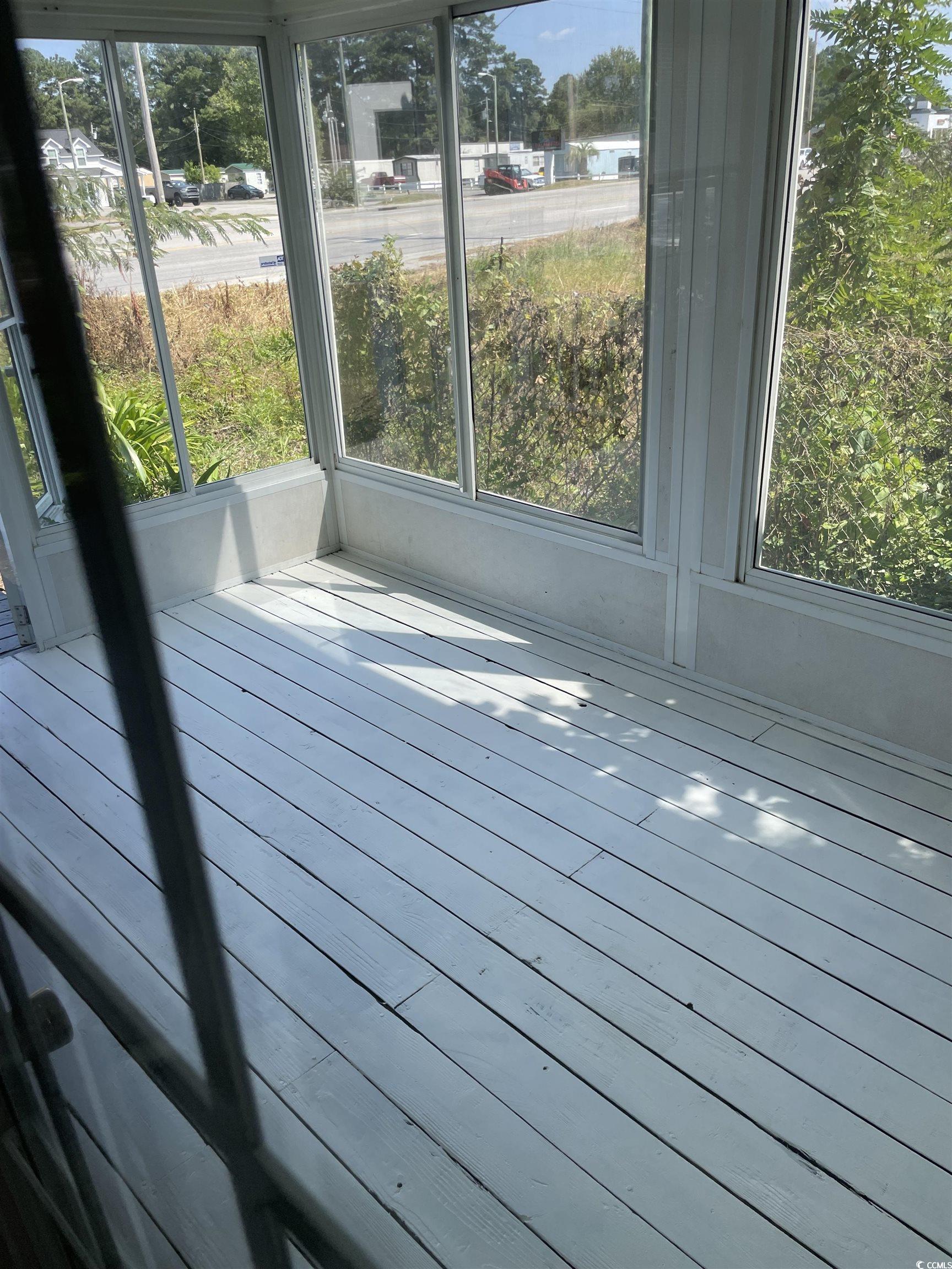 4641 Socastee Boulevard, Unit E1 Myrtle Beach, SC 29588 - Photo 20 of 20 View of unfurnished sunroom