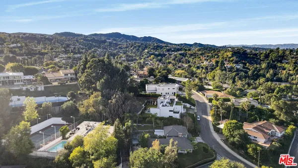 an aerial view of residential house and outdoor space