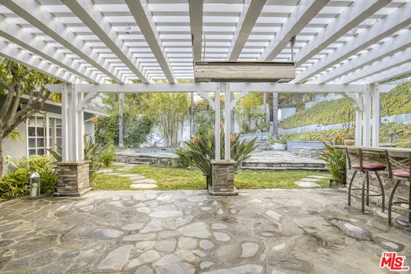 a view of swimming pool with outdoor seating
