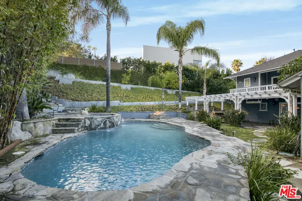 a view of a swimming pool with a patio