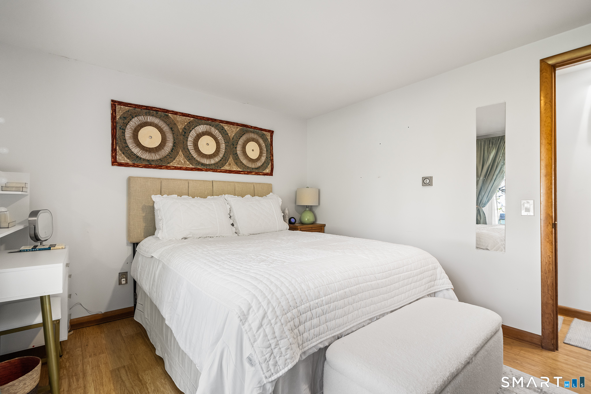 6 Shore Road Waterford, CT 06385 - Photo 19 of 40 a bedroom with a bed and a table in it