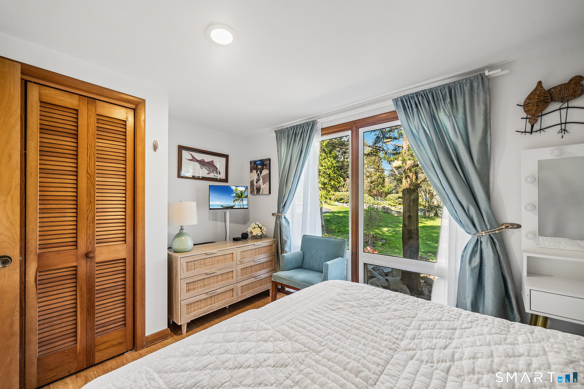 6 Shore Road Waterford, CT 06385 - Photo 20 of 40 a bedroom with a bed and large window