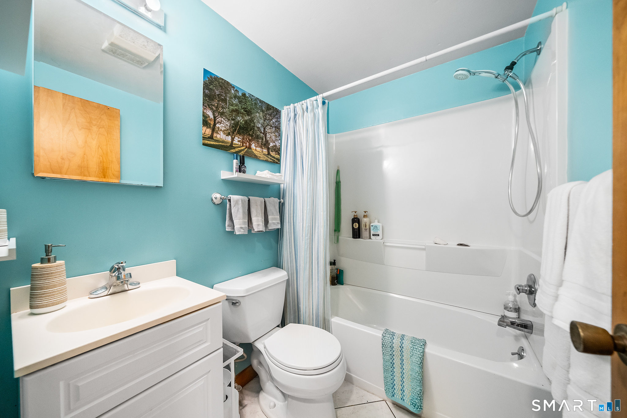 6 Shore Road Waterford, CT 06385 - Photo 21 of 40 a bathroom with a sink toilet and shower