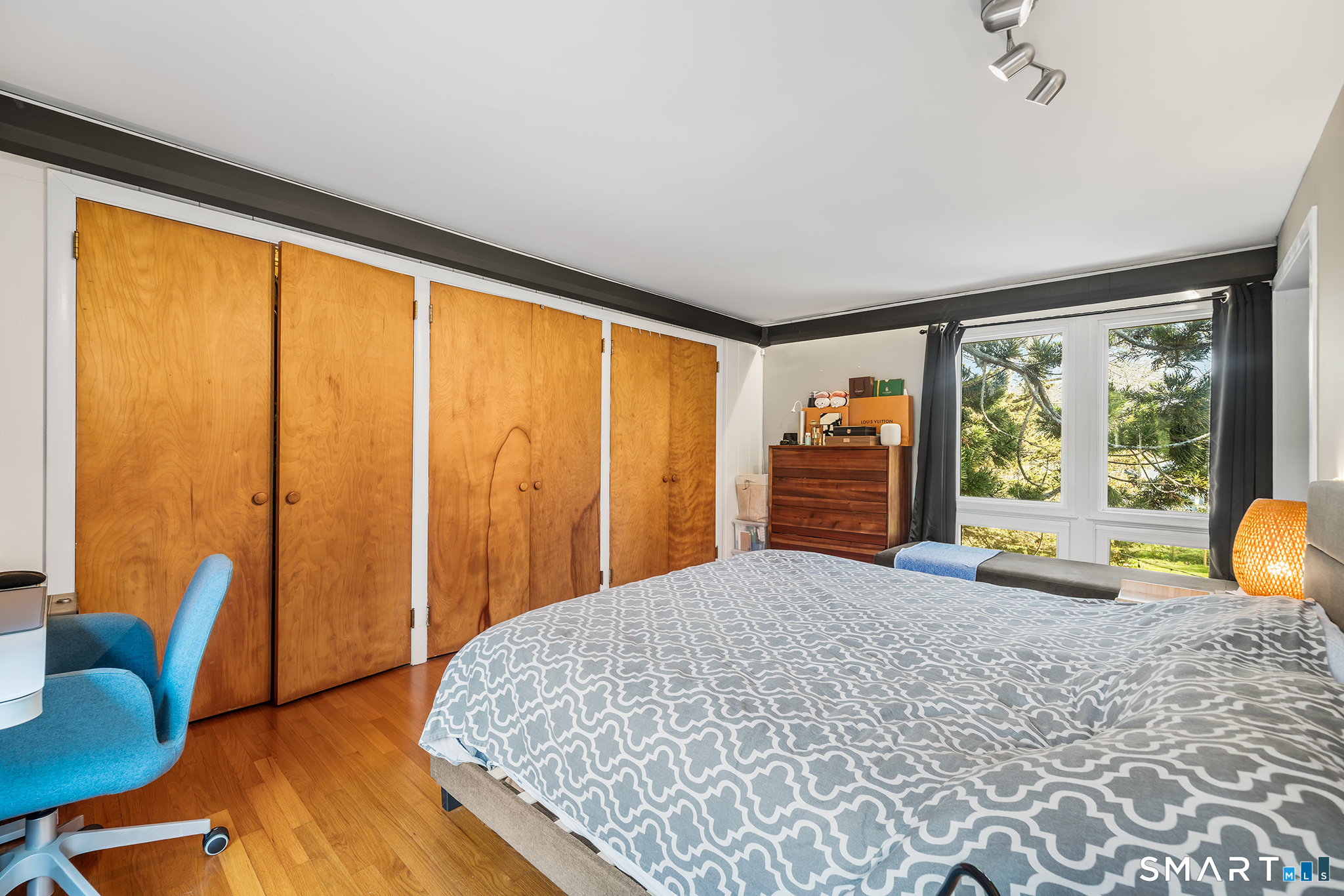 6 Shore Road Waterford, CT 06385 - Photo 26 of 40 a bedroom with furniture and large windows