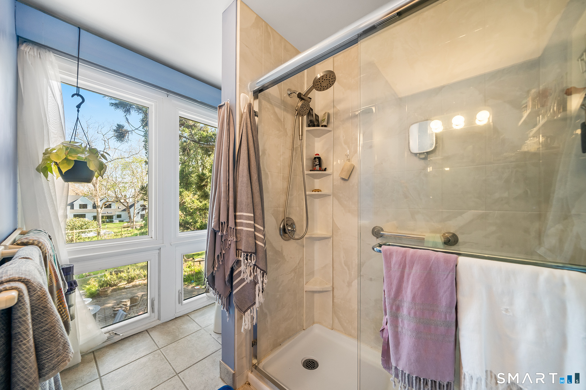 6 Shore Road Waterford, CT 06385 - Photo 28 of 40 a bathroom with a granite countertop shower a sink and a toilet