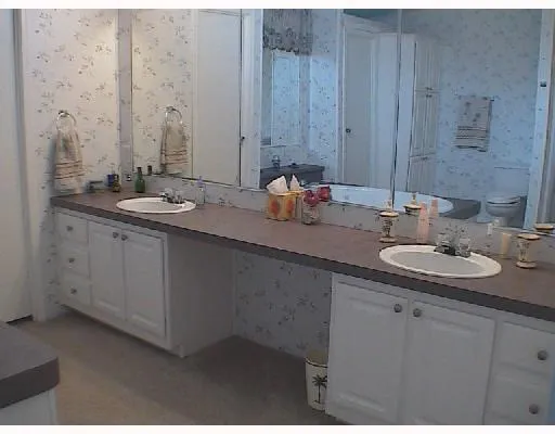 a kitchen with stainless steel appliances granite countertop a stove and cabinets