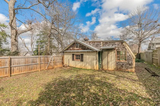 a house with trees in the background