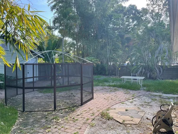 a backyard of a house with lots of green space