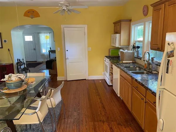 a kitchen with sink and stove