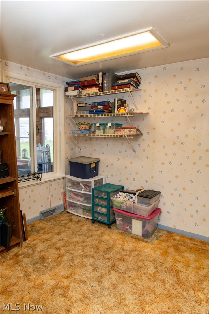 5467 Chapel Road Madison, OH 44057 - Photo 24 of 50 Room featuring wall-mounted shelving, a window, and recessed ceiling lighting