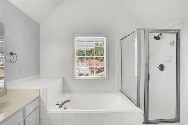 a bathroom with a double vanity sink mirror and