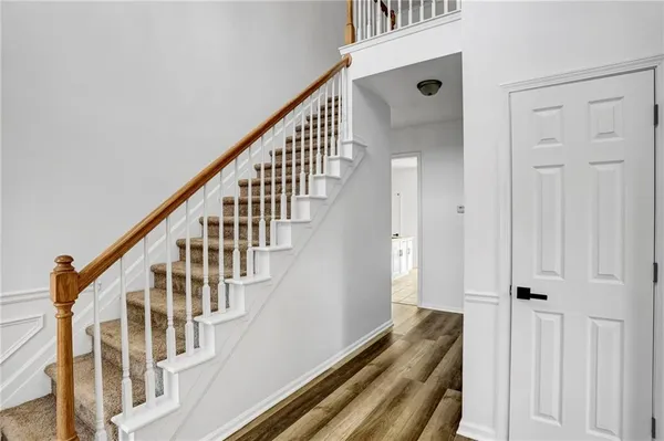 a view of staircase with wooden floor and staircase