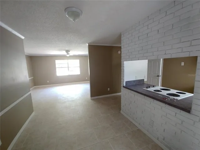 a kitchen with stainless steel appliances granite countertop a refrigerator and a stove