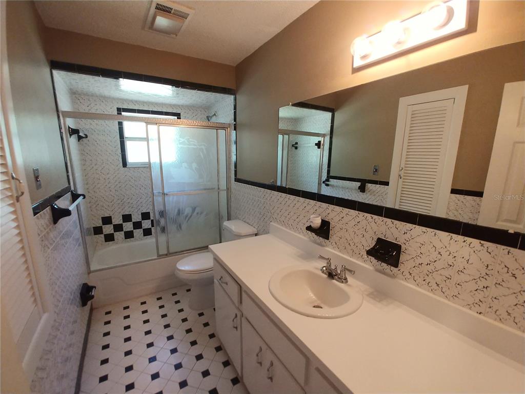 190 North Bobwhite Point Inverness, FL 34453 - Photo 9 of 13 a bathroom with a sink a toilet and shower