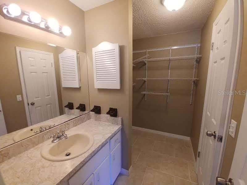 190 North Bobwhite Point Inverness, FL 34453 - Photo 10 of 13 a bathroom with a sink shower and a mirror