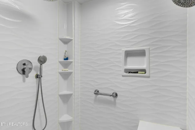 a bed room with a bed and a table