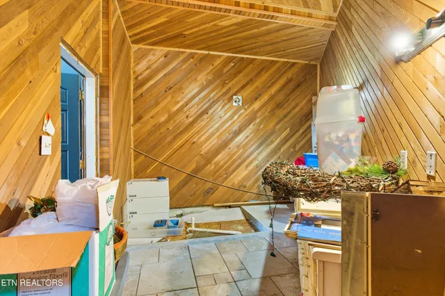 a workspace with furniture and a flat screen tv