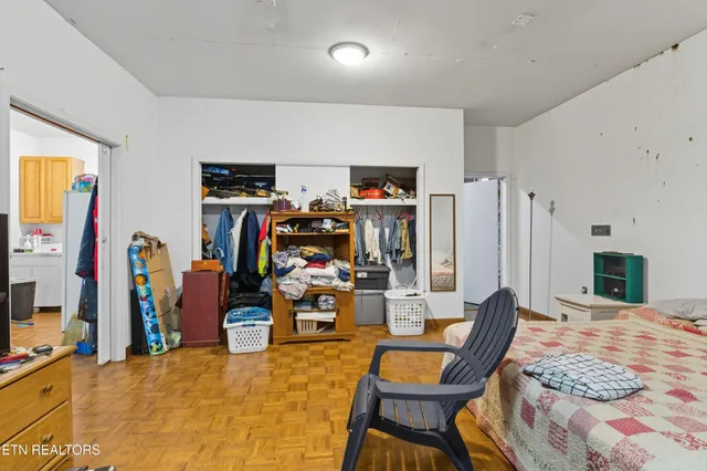 a bedroom with a bed and furniture