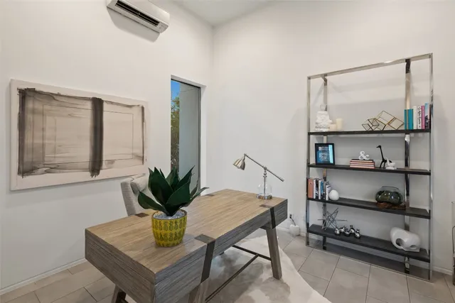 a view of living room with furniture and wooden floor