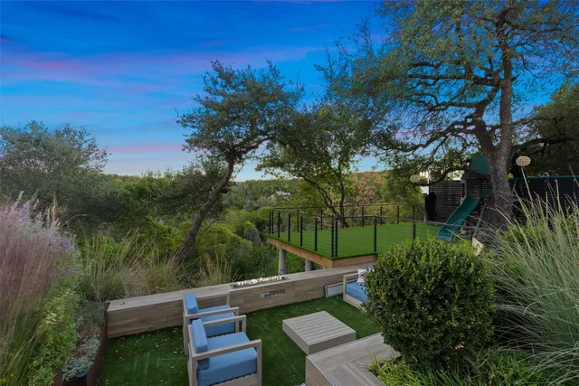 a view of house with backyard space and garden