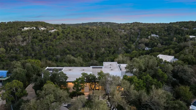 an aerial view of a house with mountain view