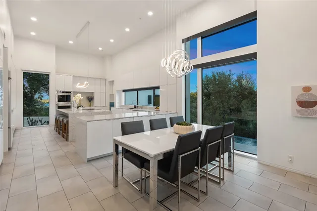 a view of a dining room kitchen island and furniture