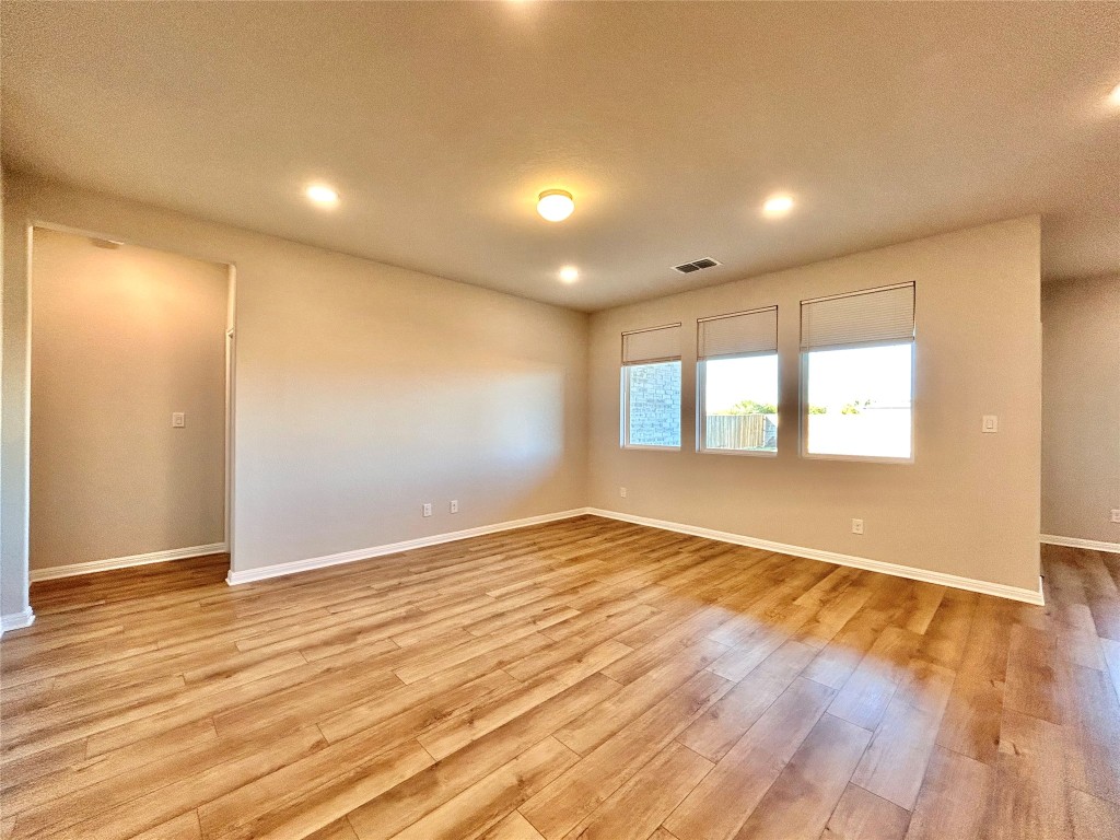 13104 Zumpango Trace Manor, TX 78653 - Photo 5 of 37 Spare room with light wood-type flooring and recessed lighting