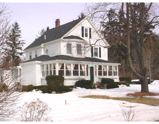 279 Concord Road Bedford, MA 01730 - Photo 1 of 1 a front view of a house with a yard covered in snow