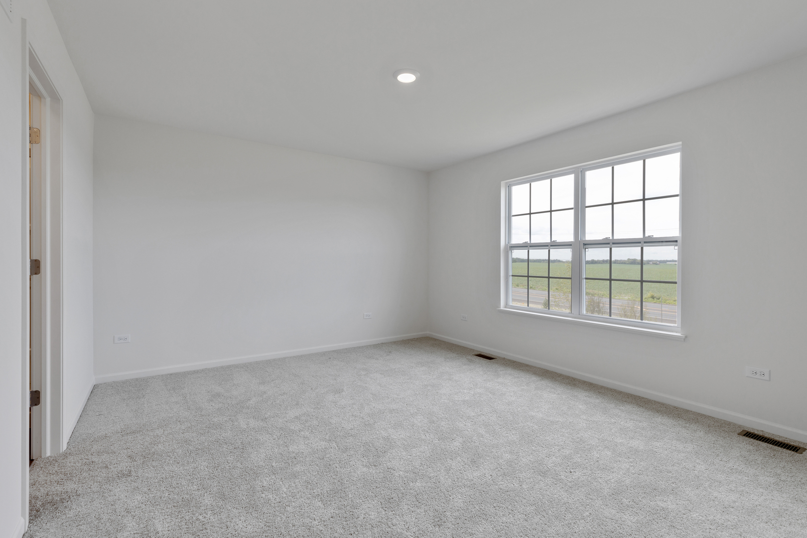 1464 Collins Street Elburn, IL 60119 - Photo 11 of 15 an empty room with a window