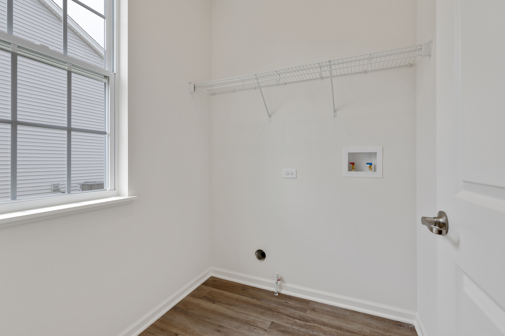 1464 Collins Street Elburn, IL 60119 - Photo 14 of 15 a view of a small space with wooden floor and a window