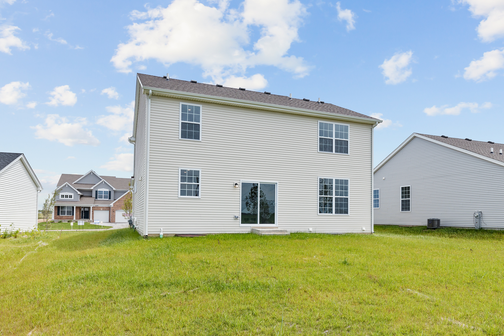 1464 Collins Street Elburn, IL 60119 - Photo 15 of 15 a view of a house with a backyard
